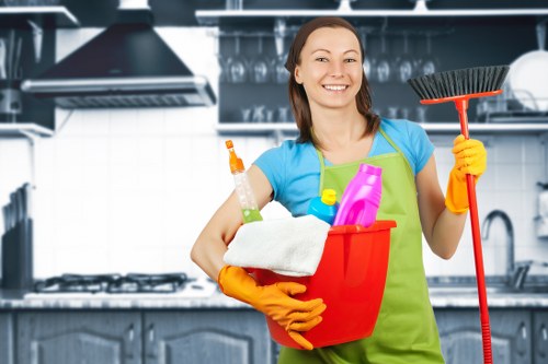 Office cleaners sanitising shared workplace surfaces in Fulham