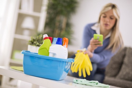 Local cleaner in Fulham carefully cleaning a kitchen surface