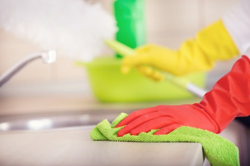 Fulham cleaning service working in a bright modern apartment